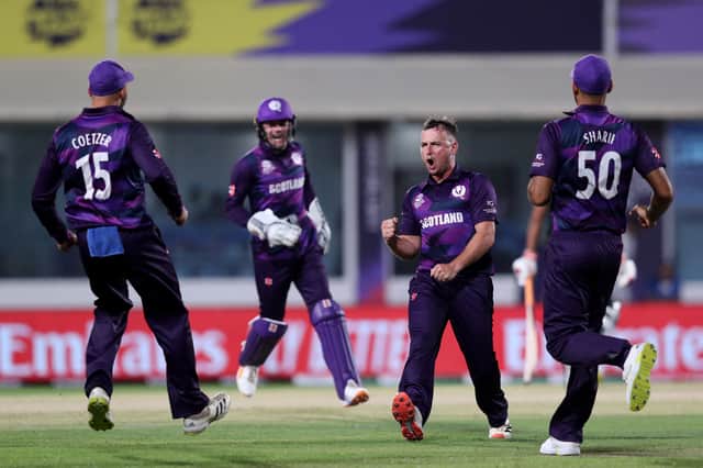 Scotland's Chris Greaves (2R) celebrates with teammates after taking the wicket of Bangladesh's Mushfiqur Rahim (not pictured) during the ICC mens Twenty20 World Cup cricket match between Bangladesh and Scotland at the Oman Cricket Academy Ground in Muscat