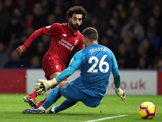 Mohamed Salah of Liverpool is challenged by Ben Foster of Watford during the Premier League match  (Photo by Richard Heathcote/Getty Images)