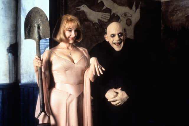 Uncle Fester and his goldigging wife 