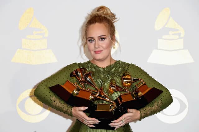 Adele, winner of Album Of The Year and Best Pop Vocal Album for ‘25’ and Song Of The Year, Record Of The Year and Best Pop Solo Performance for ‘Hello,’ poses in the press room during The 59th GRAMMY Awards (Photo: Frederick M. Brown/Getty Images)