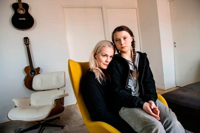 Greta Thunberg posing with her mother, opera singer Malena Ernman (Photo: MALIN HOELSTAD/SVD/TT/TT NEWS AGENCY/AFP via Getty Images)
