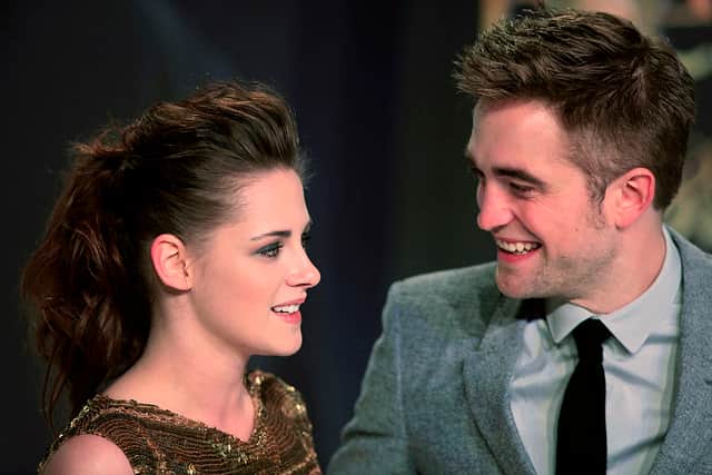 Kristen Stewart and Robert Pattinson pose prior to the German premier of “The Twilight Saga: Breaking Dawn - Part 2” in Berlin,  ​2012 (Photo: FREDERIC LAFARGUE/AFP via Getty Images