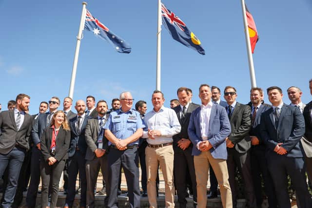 Western Australia Premiere Mark McGowan poses with police officers after speaking at a press conference in front of the Carnarvon Police Station (Picture: Getty Images)