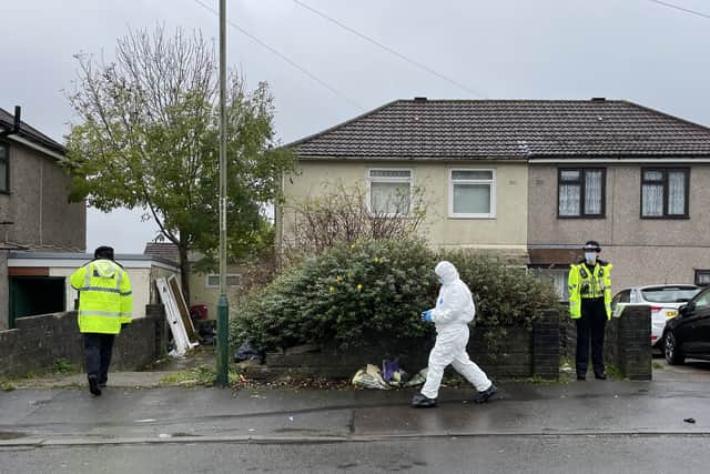  A forensic crime scene investigator is seen outside the house. The dog was destroyed by firearms officers and no other animals were involved in the attack.