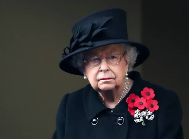 <p>In recent years, the Queen has been seen wearing five poppies on Remembrance Sunday (image: AFP/Getty Images)</p>