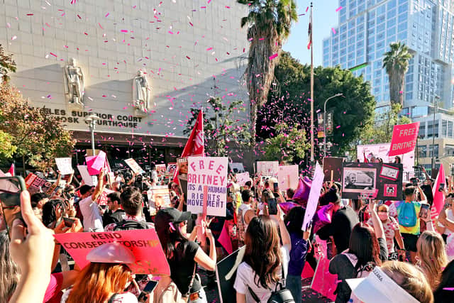 Confetti flies as protestors are seen at the #FreeBritney Termination Rally on November 12, 2021 in Los Angeles, California. (Photo by Kevin Winter/Getty Images)
