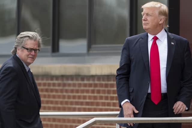 US President Donald Trump stands alongside Chief Strategist Steve Bannon (L) (Photo: Saul Loeb/AFP via Getty Images)