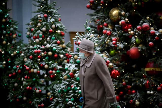 With high levels of Covid immunity and a strong booster vaccination programme, a leading scientist has warned a lockdown at Christmas is unlikely to happen (Photo by NATALIA KOLESNIKOVA/AFP via Getty Images)