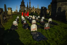 Extinction Rebellion activists are seen holding a Funeral for COP26 at the Necropolis on November 13 in Glasgow as delegates inside the conference enter final negotiations (Photo by Peter Summers/Getty Images)