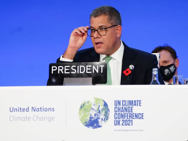 Alok Sharma President of the COP26 climate summit, raises his hands after his speech of the closing plenary, during an ‘overun’ day of the COP26 summit in Glasgow (image: PA)