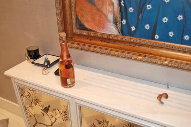 An opened £500 bottle of Cristal champagne left by burglars at the home of the late Leicester City FC chairman Thai billionaire Vichai Srivaddhanaprabha.