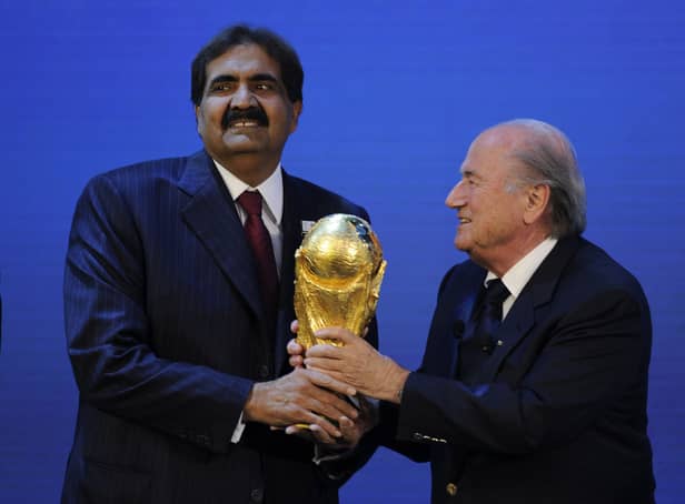 <p>Emir of the State of Qatar Sheikh Hamad bin Khalifa Al-Thani (L) receives the World Cup trophy from Fifa President Joseph Blatter (R) after the official announcement that Qatar will host the 2022 World Cup on December 2, 2010 at the FIFA headquarters in Zurich. (Pic: Getty)</p>