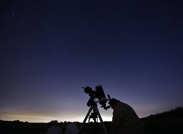<p>Members of the York Astronomical Society prepare to view the annual Perseids meteor shower in the village of Rufforth, near York, in August 2015 (Photo: OLI SCARFF/AFP via Getty Images)</p>