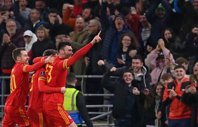 <p>Kieffer Moore scored another vital goal for Wales as they held the world’s best team. (Photo by PAUL ELLIS/AFP via Getty Images)</p>
