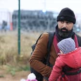 Thousands of migrants from countries like Iraq and Syria have been trying to get into Poland from Belarus (image: BELTA/AFP via Getty Images)