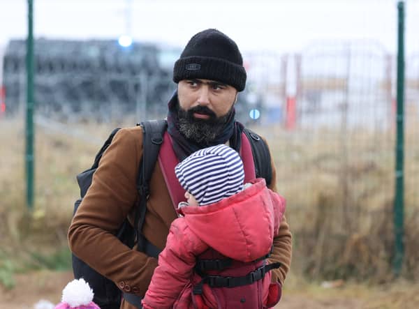 Thousands of migrants from countries like Iraq and Syria have been trying to get into Poland from Belarus (image: BELTA/AFP via Getty Images)