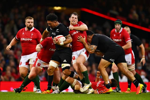 Wyn Jones attempts a tackle in Wales defeat to New Zealand