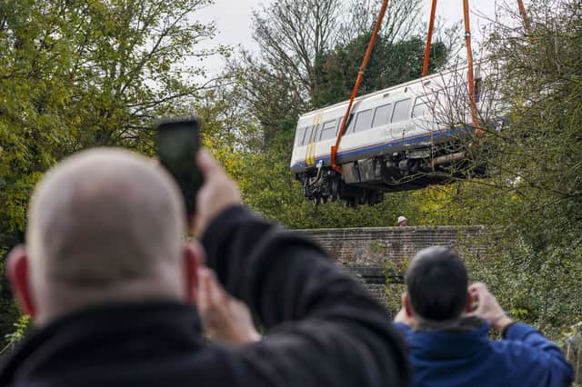 The train carriages involved in the Salisbury train crash were removed by crane (image: PA)
