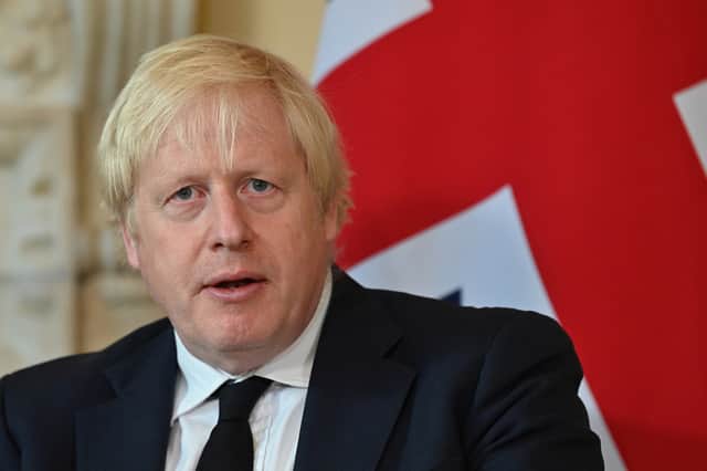 Boris Johnsonj has said that France must “do more” to curb migrant crossings after a boat capsized in the English Channel killing 27 people. (Credit: Getty)
