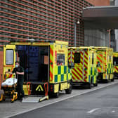 A paramedic wheels a stretcher off an ambulance outside the Royal London Hospital in east London on November 12, 2021 (Photo: Getty)