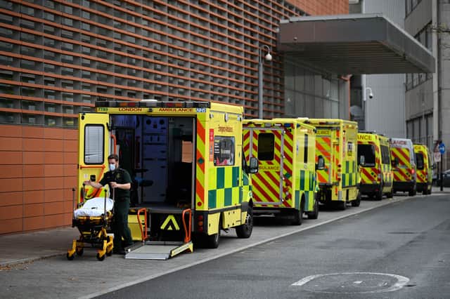 <p>A paramedic wheels a stretcher off an ambulance outside the Royal London Hospital in east London on November 12, 2021 (Photo: Getty)</p>