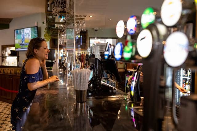 A customer orders drinks at the bar at a Wetherspoon pub in Clapham (Photo: Getty)