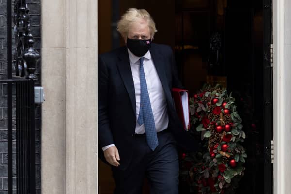 Boris Johnson is accused of hosting Christmas parties at No.10 last year while London was under strict tier three restrictions. (Credit: Getty)
