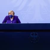 Outgoing German Chancellor, Angela Merkel, and her likely replacement Olaf Scholz have announced a new nationwide lockdown for all unvaccinated German citizens. (Credit: Getty)