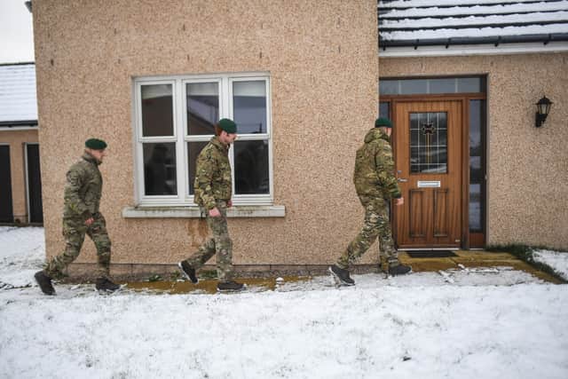Troops make house-visit to check on the welfare of disconnected residents in Aberdeenshire. (Credit: Getty)