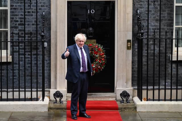 Thumbs up - Boris Johnson has said Christmas parties should go ahead despite rising Covid cases and the emergence of the Omicron variant (image: Getty Images)