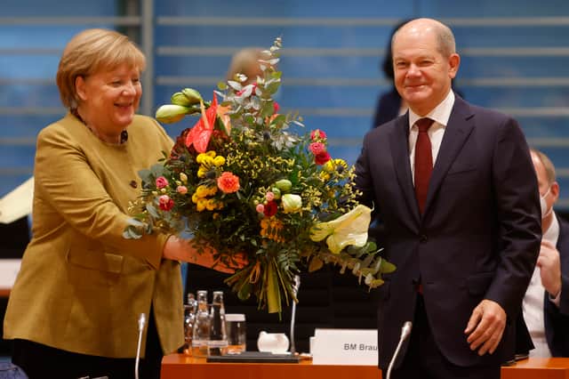 Angela Merkel has handed over the role of German Chancellor to Olaf Scholz. (Credit: Getty)