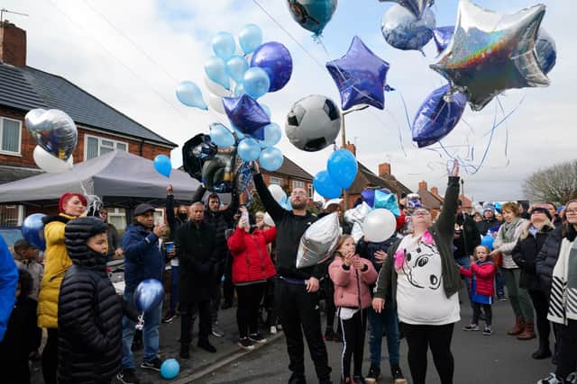 People release balloons during a tribute to Arthur Labinjo-Hughes outside Emma Tustin’s former address in Solihull