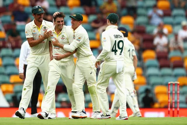 Australian captain Pat Cummins celebrates with team mates. (Photo by Chris Hyde/Getty Images)