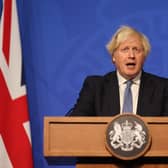 Boris Johnson has moved England into ‘Plan B’ restrictions amid fears over surging Covid cases and the spread of the Omicron variant. (Credit: Getty)