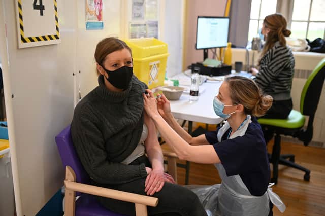 A woman receives a dose of the Moderna Covid-19 vaccine at Babington Hospital in Belper on December 16, 2021 (Photo: Getty)