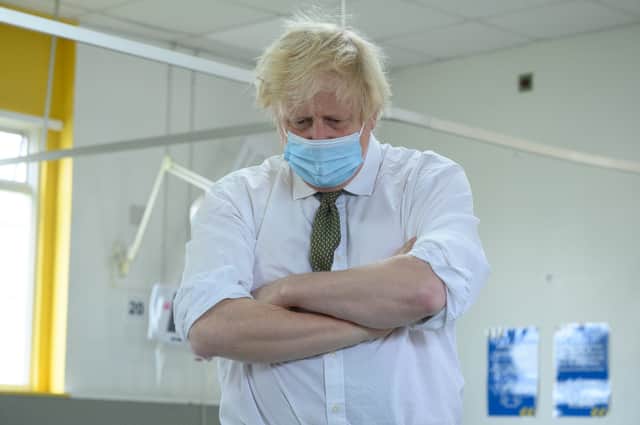 Boris Johnson confirmed that the government are revering the “possibility of taking further action” as Covid-19 cases surge across the country.  (Credit: Getty)
