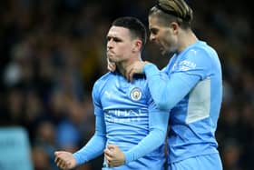 Phil Foden of Manchester City celebrates after scoring their side's first goal with Jack Grealish during the Premier League match between Manchester City and Leeds United at Etihad Stadium on December 14