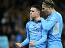 Phil Foden of Manchester City celebrates after scoring their side's first goal with Jack Grealish during the Premier League match between Manchester City and Leeds United at Etihad Stadium on December 14