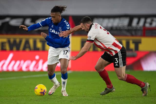 Alex Iwobi of Everton and Enda Stevens of Sheffield United during the Premier League match between Sheffield United and Everton at Bramall Lane on December 26, 2020