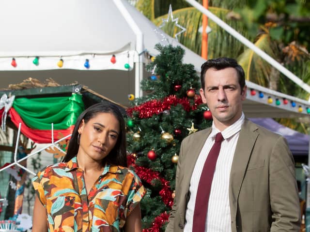 Josephine Jobert as DS Florence Cassell and Ralf Little as DI Neville Parker in Death in Paradise (Credit: BBC / Red Planet / Denis Guyenon)
