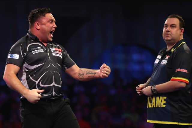 Gerwyn Price of Wales reacts during his Third Round Match against Kim Huybrechts of Belgium during Day Ten of the William Hill World Darts Championship at Alexandra Palace on December 27, 2021