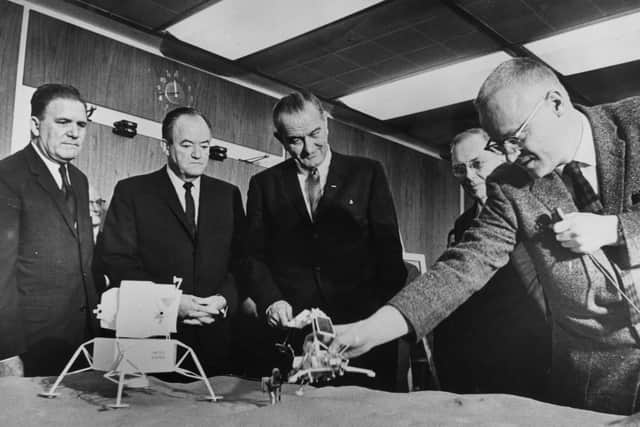 Webb (left) with Vice President Hubert Humphrey, President Johnson and others at a NASA briefing in 1965 (Picture: Getty)
