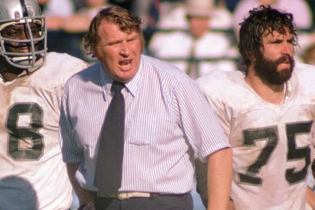 Madden argues with a referee during a 1974 divisional round playoff game against the two-time defending Super Bowl champion Miami Dolphins