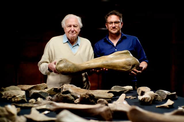 David Attenborough and Ben Garrod hold up a Mammoth bone (Credit: BBC/Windfall Films/Julian Schwanitz)