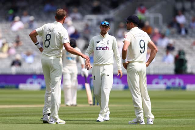 Joe Root of England speaks to Stuart Broad and James Anderson during Day 2 of the First LV= Insurance Test Match between England and New Zealand at Lord's Cricket Ground on June 03, 2021 in London, England. 