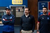 Brendan Hunt as Coach Beard, Jason Sudeikis as Ted Lasso, and Brett Goldstein as Roy Kent (Credit: Colin Hutton/Apple TV+)