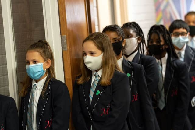 Face covering recommendations are being reintroduced for students returning to schools in England (Photo: OLI SCARFF/AFP via Getty Images)