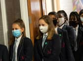 Face covering recommendations are being reintroduced for students returning to schools in England (Photo: OLI SCARFF/AFP via Getty Images)
