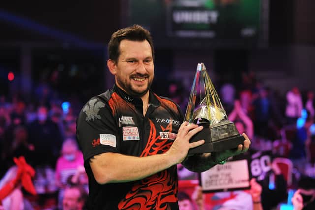 Jonny Clayton of Wales poses with the trophy after winning his Final match against Jose de Sousa of Portugal during Night 17 of the Unibet Premier League Darts at Marshall Arena on May 28, 2021 in Milton Keynes, England.