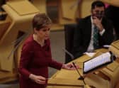 Nicola Sturgeon has announced that self-isolation has been cut from 10 days to seven day for those in Scotland. (Credit: Getty)